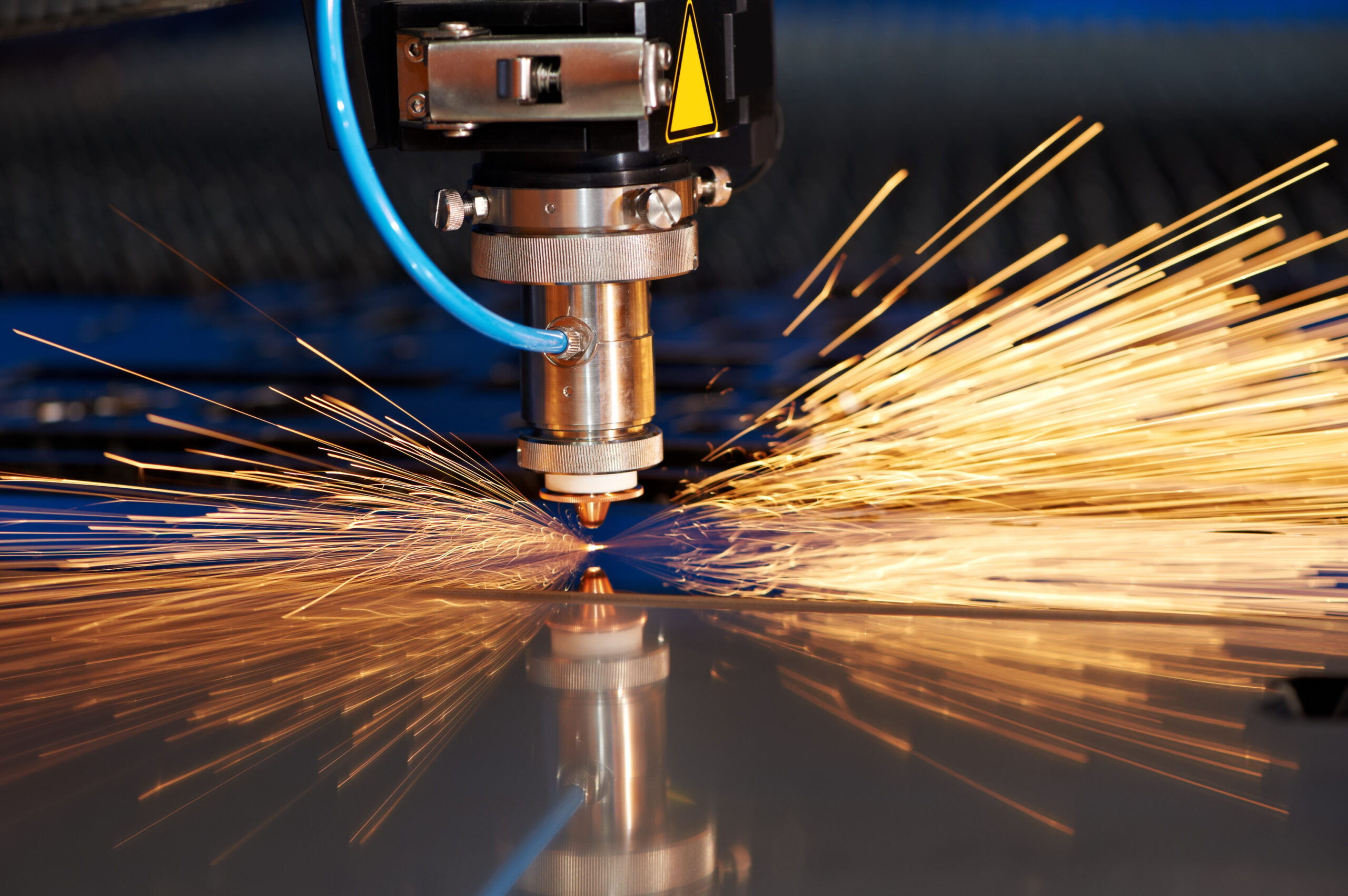 Laser cutting of metal sheet with sparks